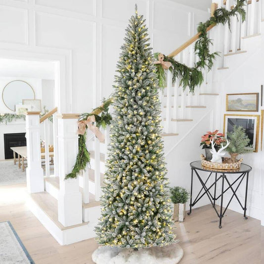 11 ft. Pre-Lit Flocked Pencil Fir Artificial Christmas Tree with 950 Warm White Lights